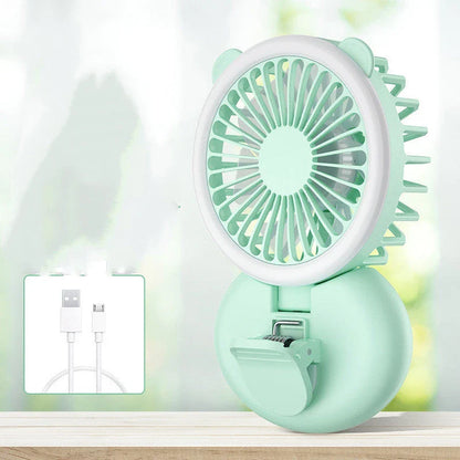 Portable USB-powered mini fan with LED fill light for taking selfies and videos in low-light conditions
