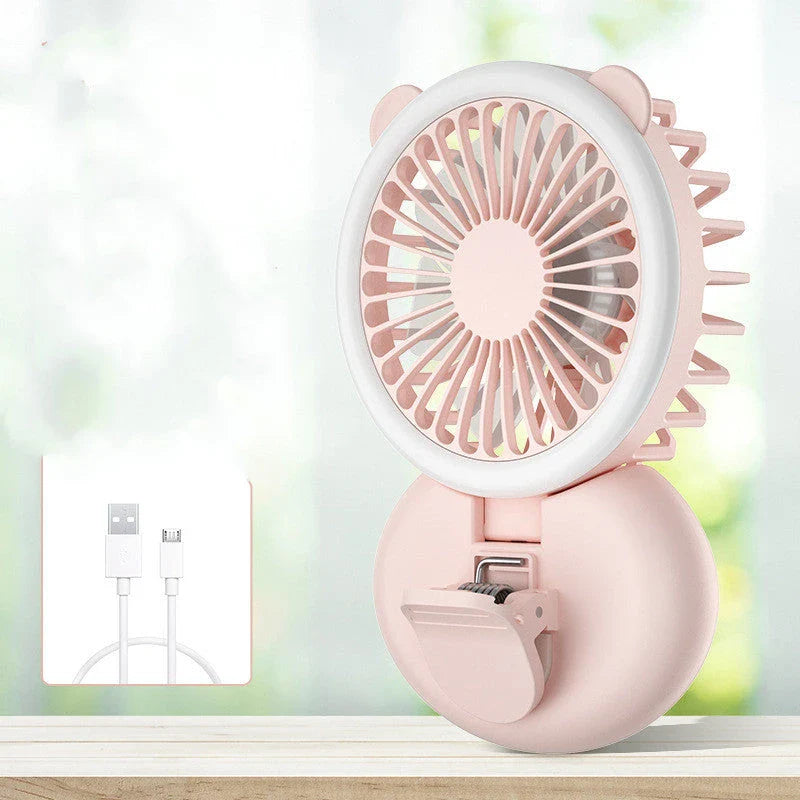 Portable USB-powered mini fan with LED fill light for taking selfies and videos in low-light conditions