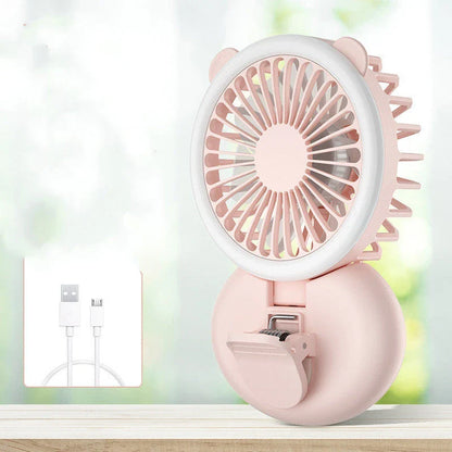 Portable USB-powered mini fan with LED fill light for taking selfies and videos in low-light conditions