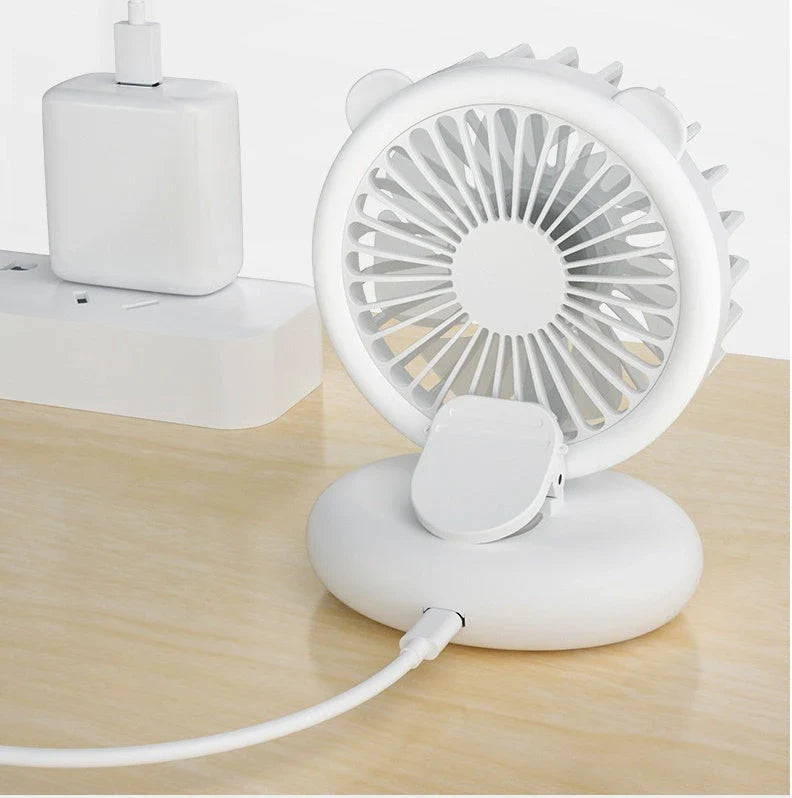 Portable USB-powered mini fan with LED fill light for taking selfies and videos in low-light conditions