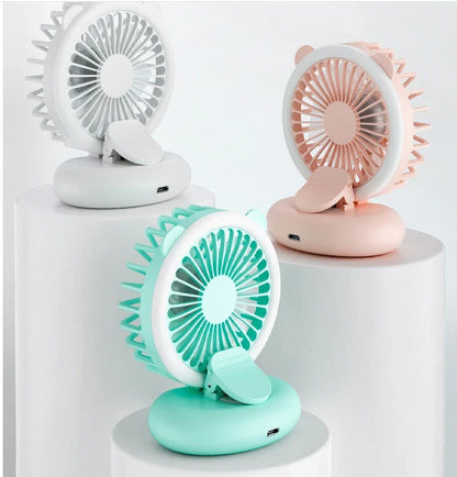 Portable USB-powered mini fan with LED fill light for taking selfies and videos in low-light conditions