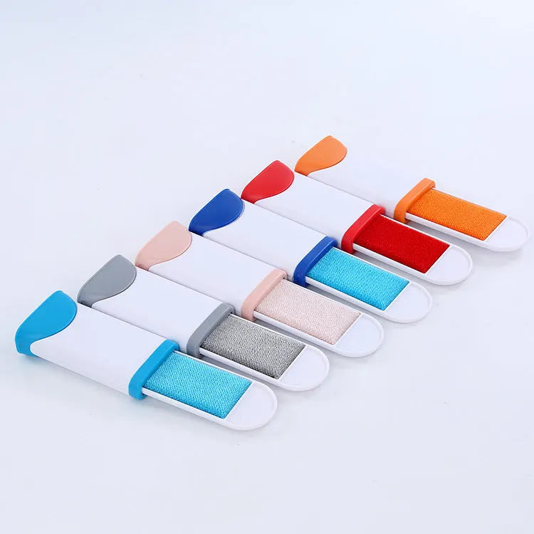 Double-sided pet brush fur comb tool with self-cleaning base, reusable and portable, in dark blue, gray, light blue, orange, and red.