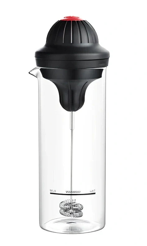 Black electric milk frother with lead-free glass jar and stainless steel whisk on kitchen counter
