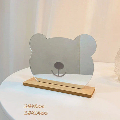 Acrylic makeup mirror with irregular edge and wooden base, available in various decorative styles