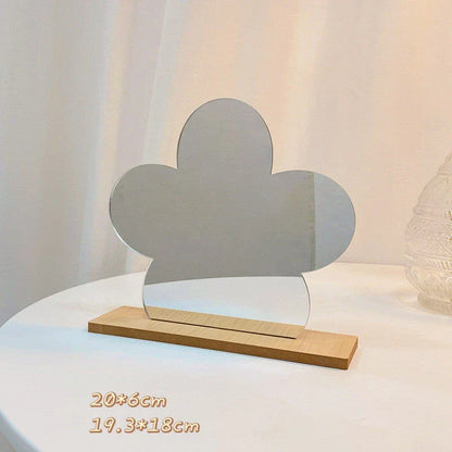 Acrylic makeup mirror with irregular edge and wooden base, available in various decorative styles