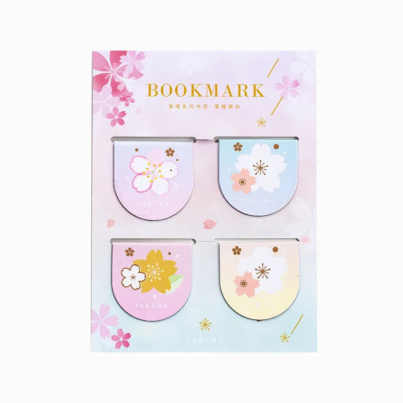 Set of four sakura-themed magnetic bookmarks showing cherry blossom designs on stone paper
