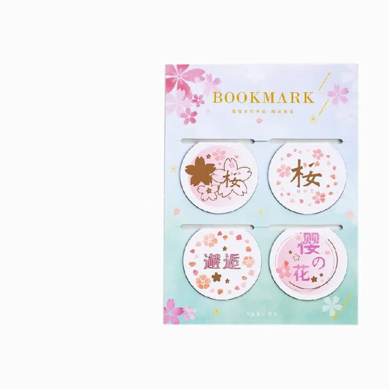 Set of four sakura-themed magnetic bookmarks showing cherry blossom designs on stone paper