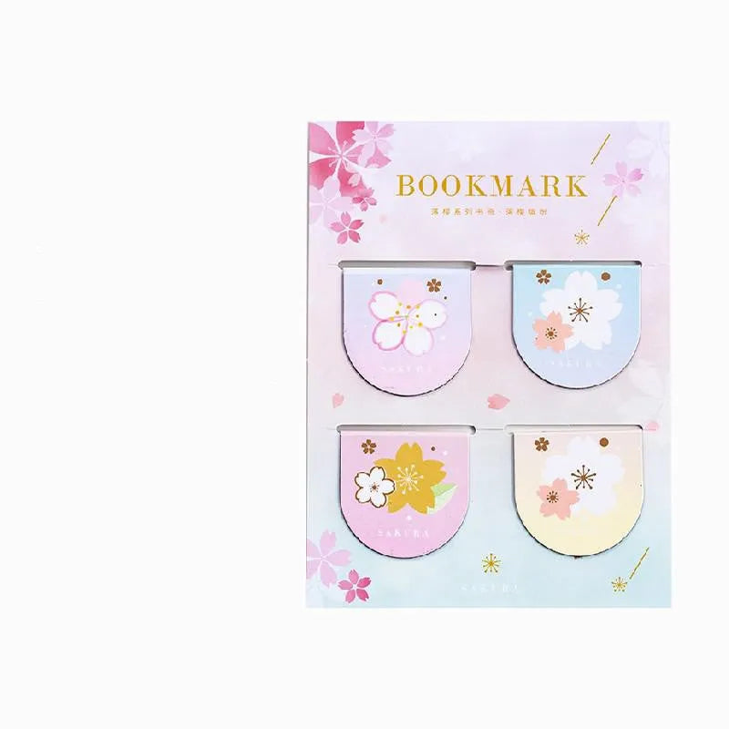 Set of four sakura-themed magnetic bookmarks showing cherry blossom designs on stone paper