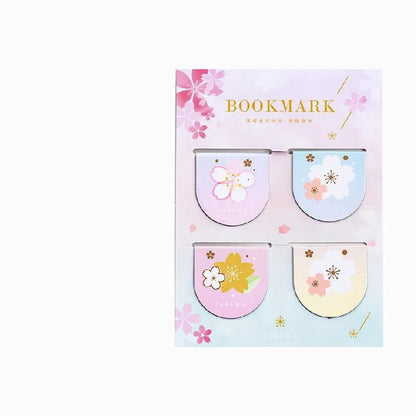 Set of four sakura-themed magnetic bookmarks showing cherry blossom designs on stone paper