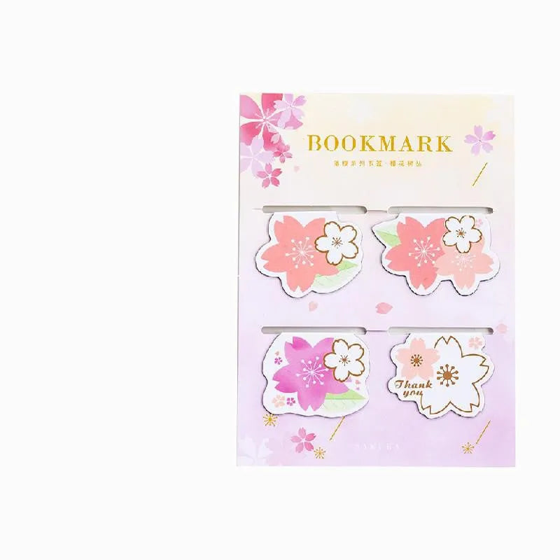 Set of four sakura-themed magnetic bookmarks showing cherry blossom designs on stone paper
