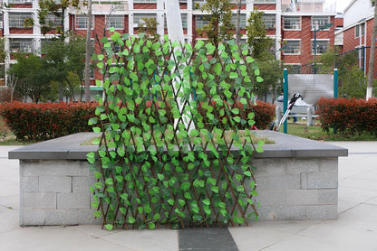 Simulation wooden garden fence with telescopic sections expanded to 60cm width beside flowering plants