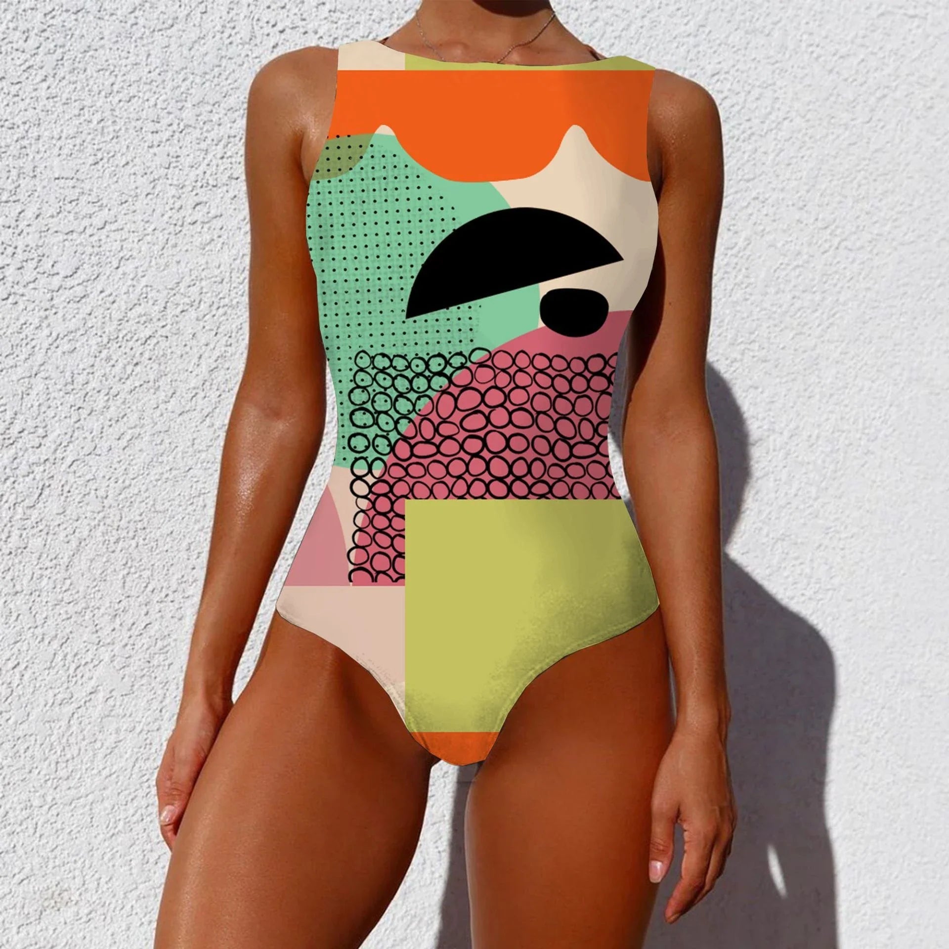 Stylish one-piece swimsuit featuring a bold, vintage-inspired abstract print in a variety of vibrant color options