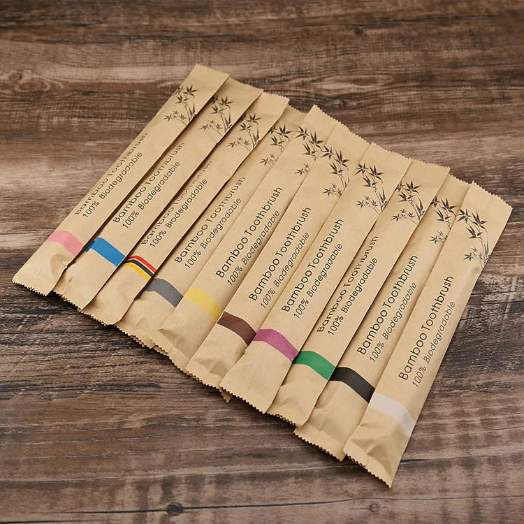 10 bamboo toothbrushes with charcoal bristles in multiple colours including green, purple, yellow, white, grey and black