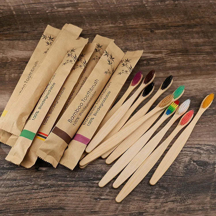 10 bamboo toothbrushes with charcoal bristles in multiple colours including green, purple, yellow, white, grey and black