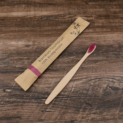 10 bamboo toothbrushes with charcoal bristles in multiple colours including green, purple, yellow, white, grey and black