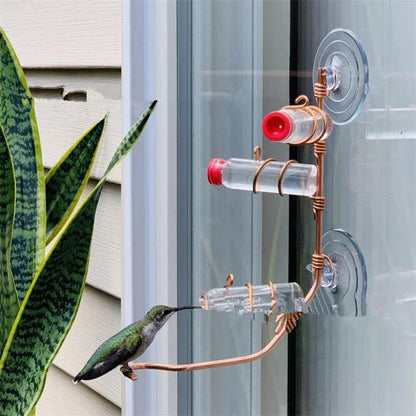 Decorative copper wire hummingbird feeder with transparent PET bottles and suction cup for easy installation in gardens, decks, or patios