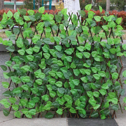 Simulation wooden garden fence with telescopic sections expanded to 60cm width beside flowering plants