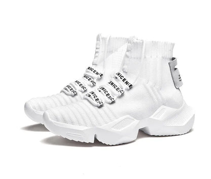 Men's black and white socks-style casual sports shoes with mesh lining, shown in large sizes.
