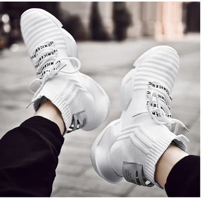 Men's black and white socks-style casual sports shoes with mesh lining, shown in large sizes.