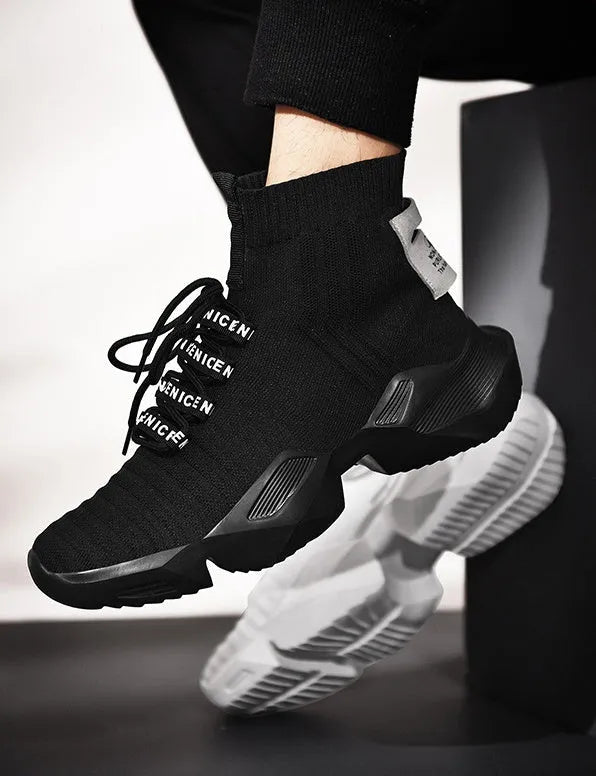 Men's black and white socks-style casual sports shoes with mesh lining, shown in large sizes.