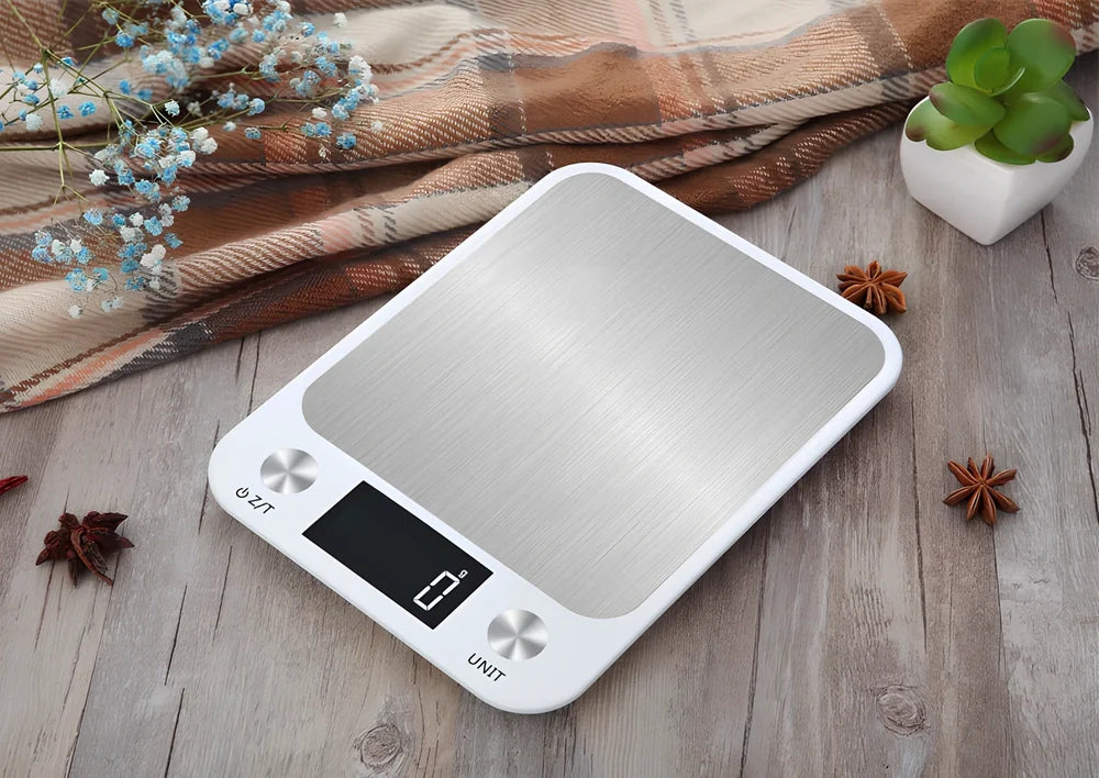 Stainless steel digital kitchen scale with LCD display showing weight measurement