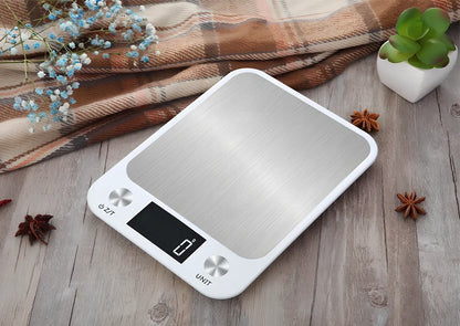 Stainless steel digital kitchen scale with LCD display showing weight measurement