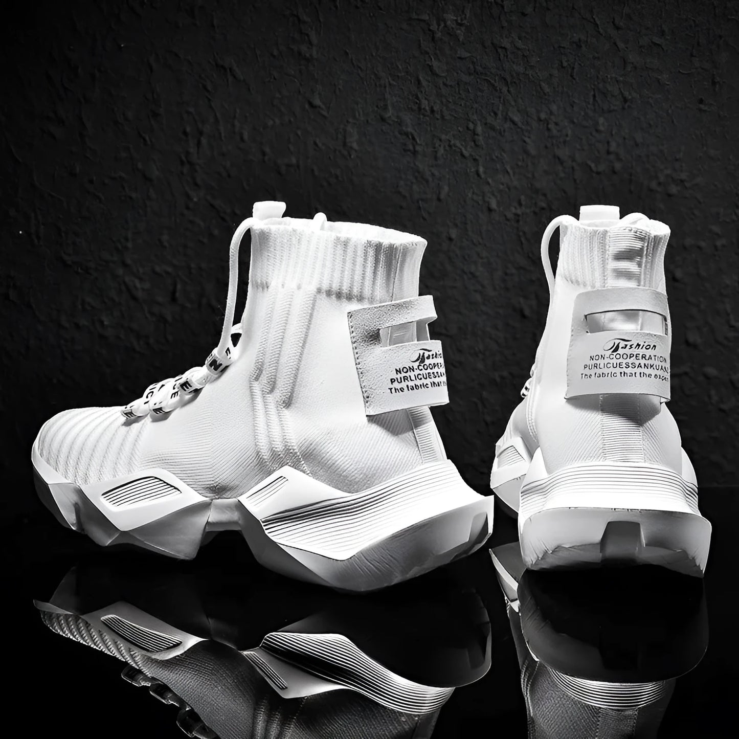 Men's black and white socks-style casual sports shoes with mesh lining, shown in large sizes.