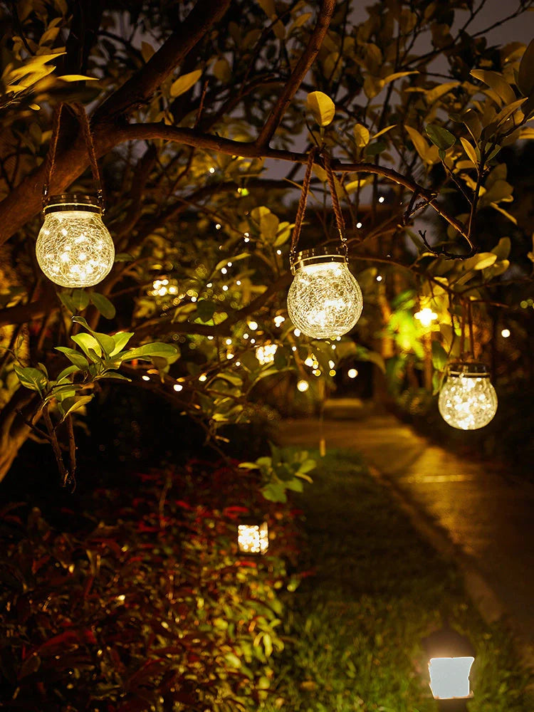 Spherical glass solar LED garden lamp with waterproof design and warm white light