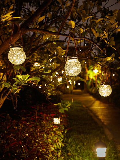 Spherical glass solar LED garden lamp with waterproof design and warm white light