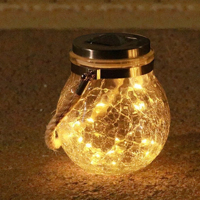 Spherical glass solar LED garden lamp with waterproof design and warm white light