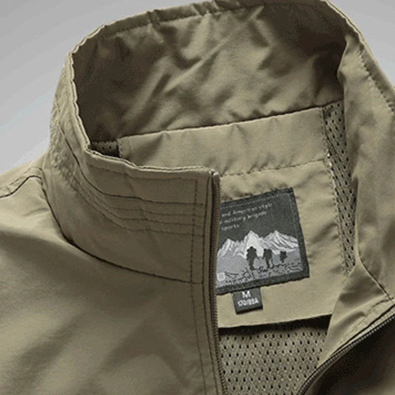 Men's Outdoor Vest in various colors, featuring a stand-up collar, zipper closure, and durable cotton-blend fabric for superior comfort and protection.