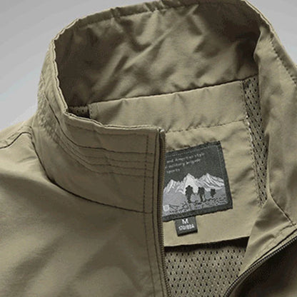 Men's Outdoor Vest in various colors, featuring a stand-up collar, zipper closure, and durable cotton-blend fabric for superior comfort and protection.