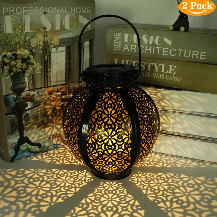 Black six-sided solar garden hanging lamp with wrought iron frame and clear glass panels