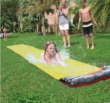 Inflatable water park with spray feature and water slide for children's outdoor play