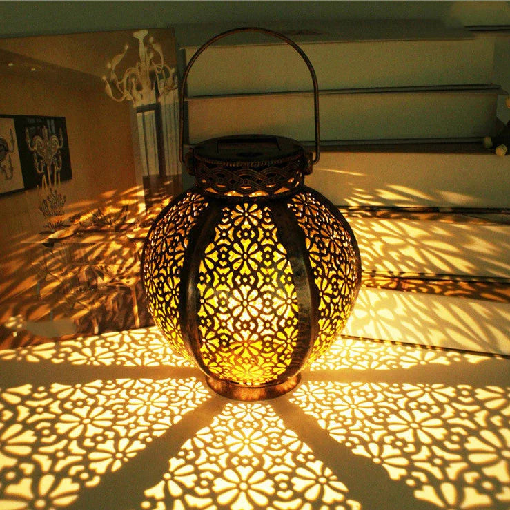 Black six-sided solar garden hanging lamp with wrought iron frame and clear glass panels