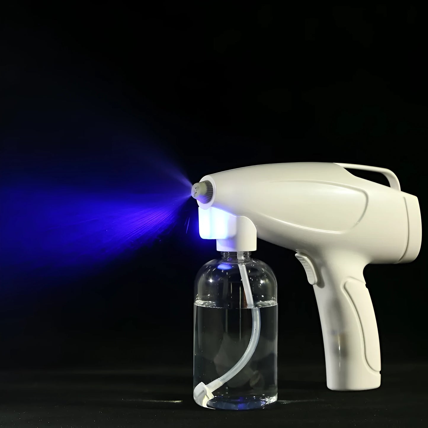White cordless handheld electric spray gun with bottle, showing mist spray and USB Type-C charging port.