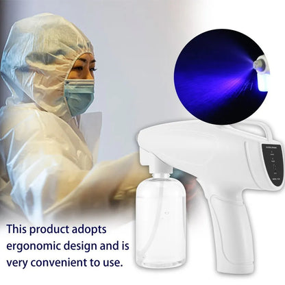 White cordless handheld electric spray gun with bottle, showing mist spray and USB Type-C charging port.