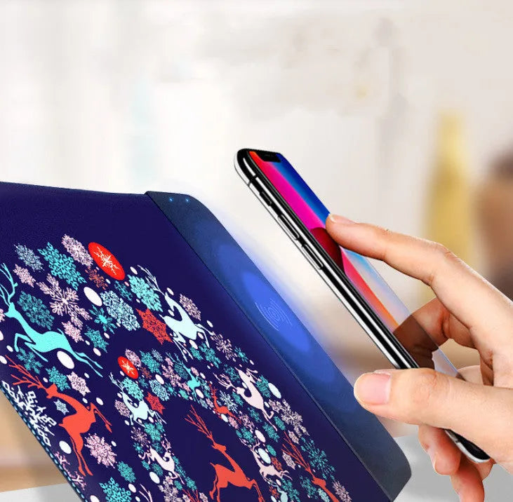 Wireless charging mouse pad showing 298x215mm surface with smartphone charging on integrated Qi pad