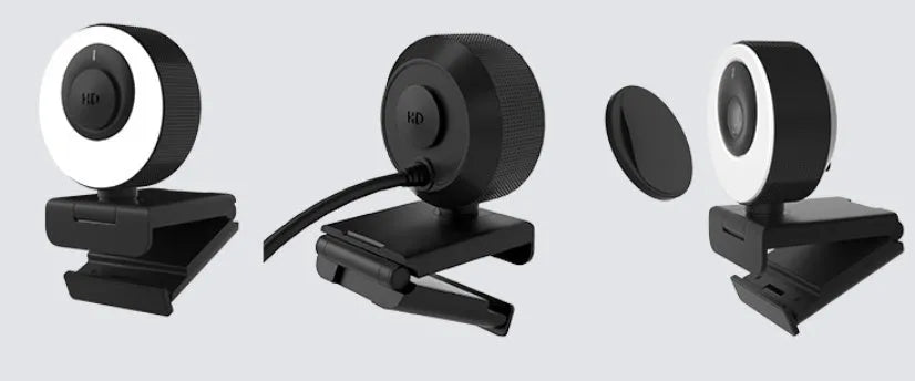 Black USB webcam with magnetic privacy cover on a laptop, showing 1080p resolution and built-in microphone.