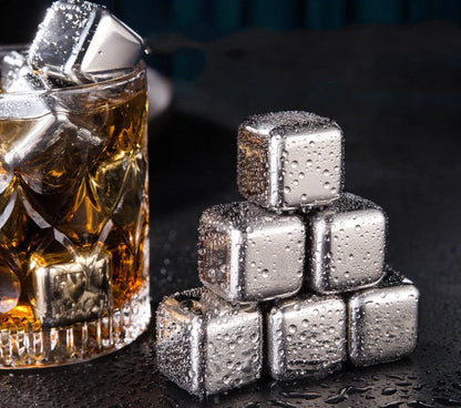 Stainless steel ice cubes in gold and silver finishes with tongs for chilling drinks without dilution