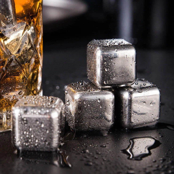 Stainless steel ice cubes in gold and silver finishes with tongs for chilling drinks without dilution
