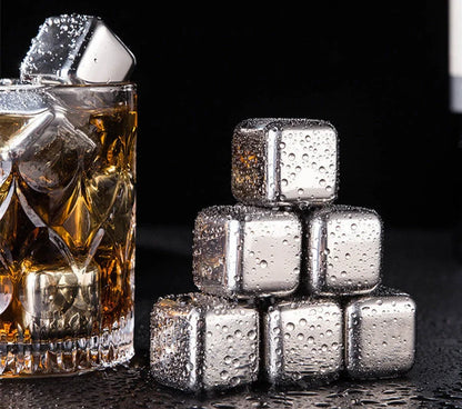Stainless steel ice cubes in gold and silver finishes with tongs for chilling drinks without dilution