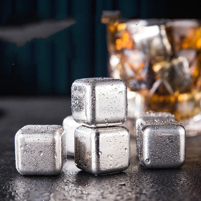 Stainless steel ice cubes in gold and silver finishes with tongs for chilling drinks without dilution
