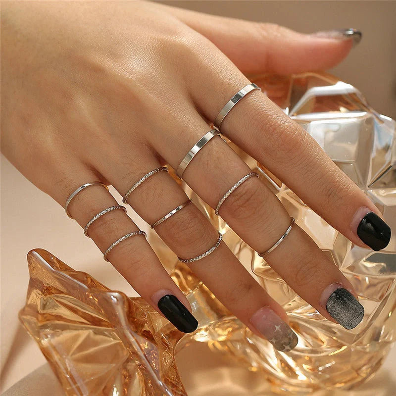 A 10-piece set of bohemian-inspired silver rings with a sleek, geometric design for a stylish, layered look