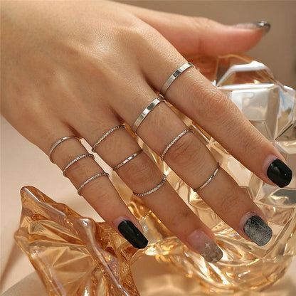 A 10-piece set of bohemian-inspired silver rings with a sleek, geometric design for a stylish, layered look