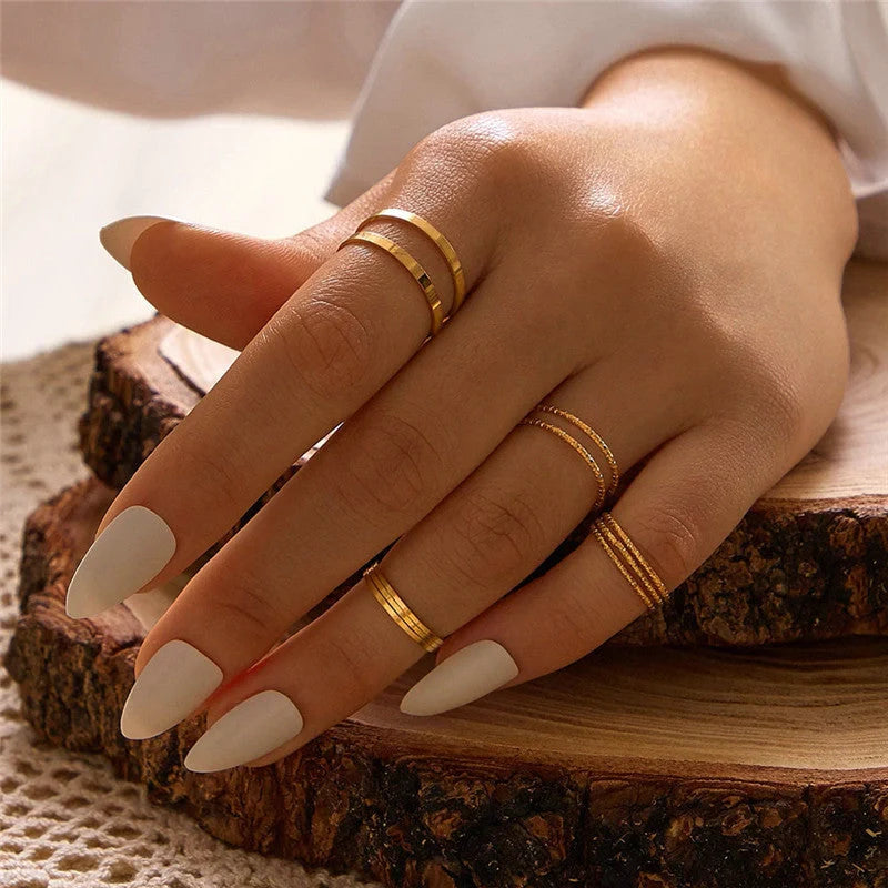A 10-piece set of bohemian-inspired silver rings with a sleek, geometric design for a stylish, layered look