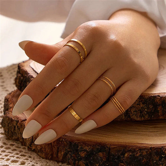 A 10-piece set of bohemian-inspired silver rings with a sleek, geometric design for a stylish, layered look