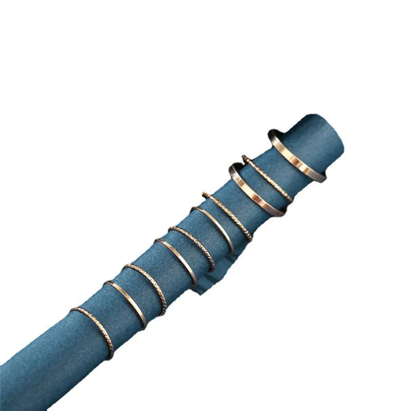 A 10-piece set of bohemian-inspired silver rings with a sleek, geometric design for a stylish, layered look