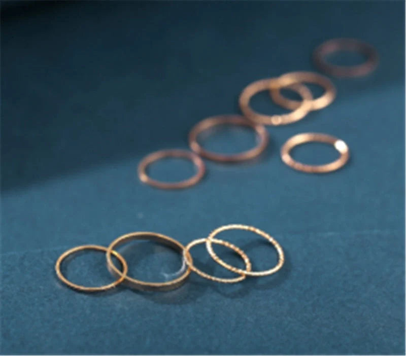 A 10-piece set of bohemian-inspired silver rings with a sleek, geometric design for a stylish, layered look