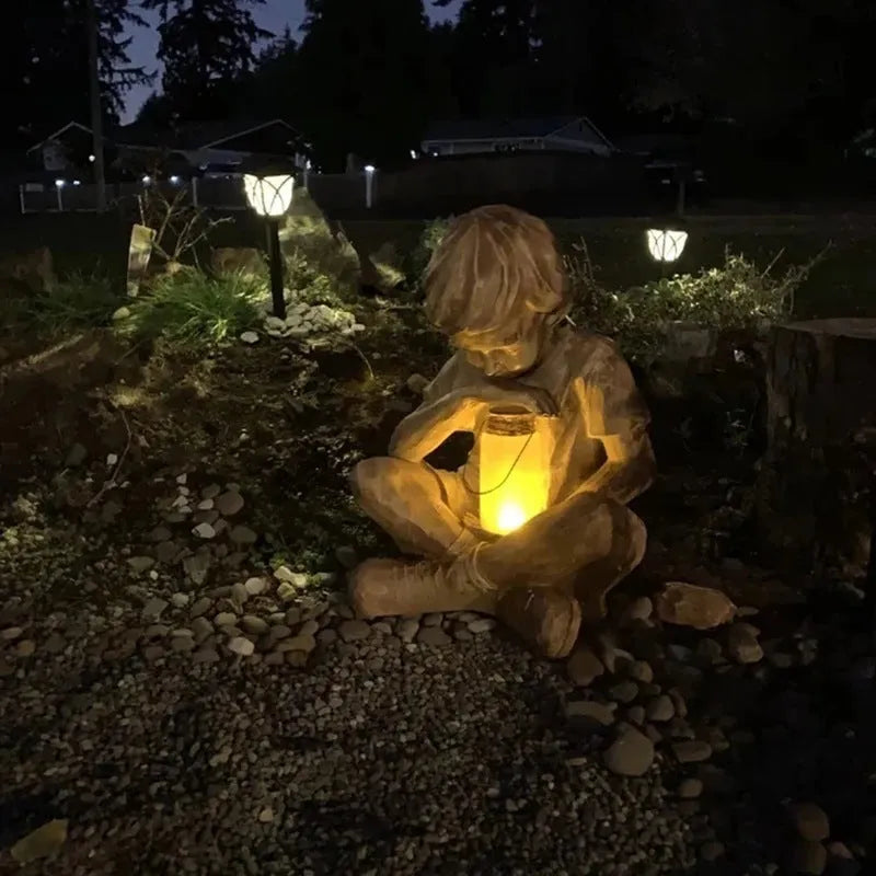 Brown natural resin tabletop ornament with little boy design from The Boy In The Garden